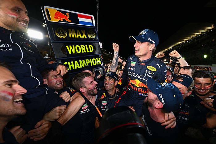 SUZUKA, JAPAN - OCTOBER 09: Race winner and 2022 F1 World Drivers Champion Max Verstappen of Netherlands and Oracle Red Bull Racing celebrates with his team after the F1 Grand Prix of Japan at Suzuka International Racing Course on October 09, 2022 in Suzuka, Japan. (Photo by Clive Mason/Getty Images)